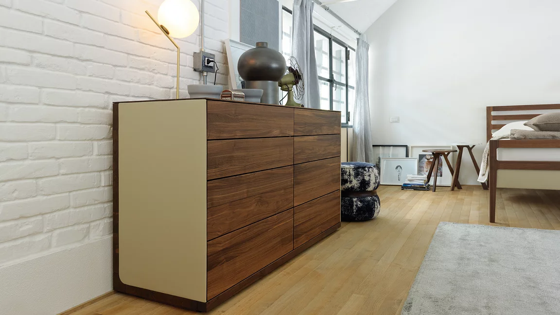timeless riletto chest of drawers in solid walnut with leather side panel