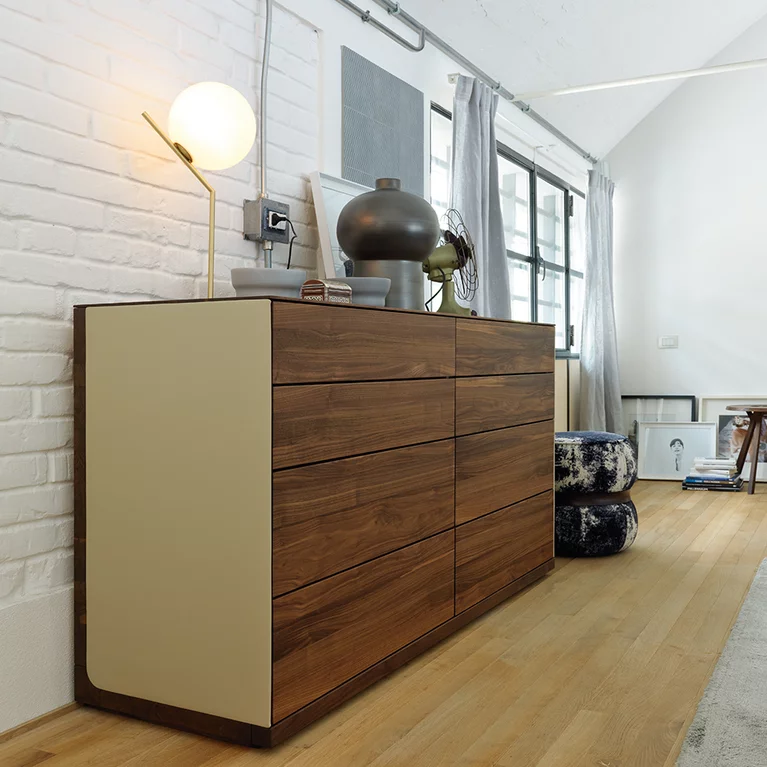 timeless riletto chest of drawers in solid walnut with leather side panel
