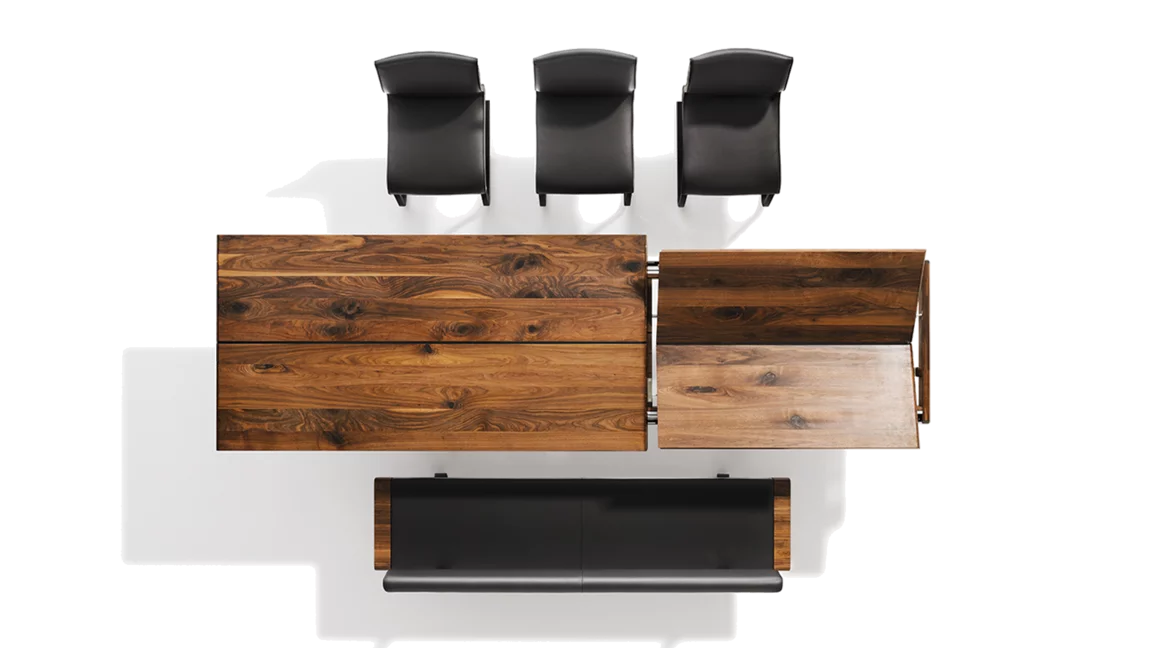 nox solid extendable dining table in wild walnut upholstered with the nox bench and the cosy magnum cantilever chairs, top view
