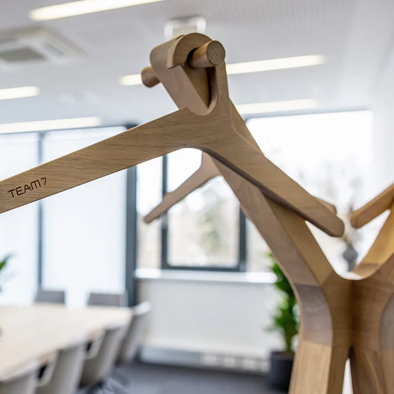 coat rack hood with coat hanger made of dimensionally stable 3-ply board in oak white oil, detailed view