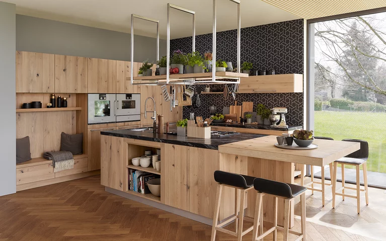 solid wood kitchen loft in wild oak white oil with extension table, ark bar stools and seating niche