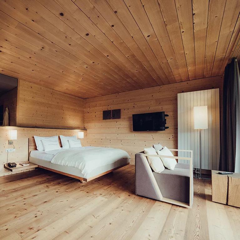 riletto bed with wooden headboard and console in walnut, bed sides with leather cover