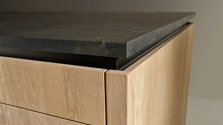 modern pur kitchen in solid oak with natural stone in the colour infinity brown, detailed view