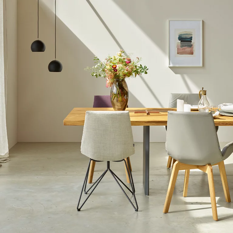 dining table echt.zeit made of wood in rustic brushed oak with the matching lui chair family, side view