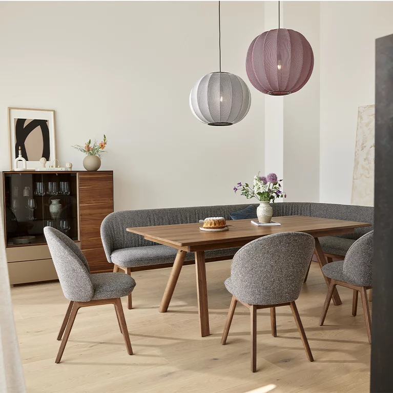 taso extendable wooden table in walnut with flor chairs and the elegant flor bench
