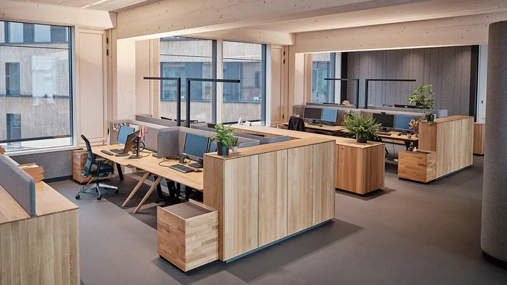 Tailor-made business interior overall solution with pisa desk, desk containers, sideboards and highboards in oak at TEAM 7 Ried