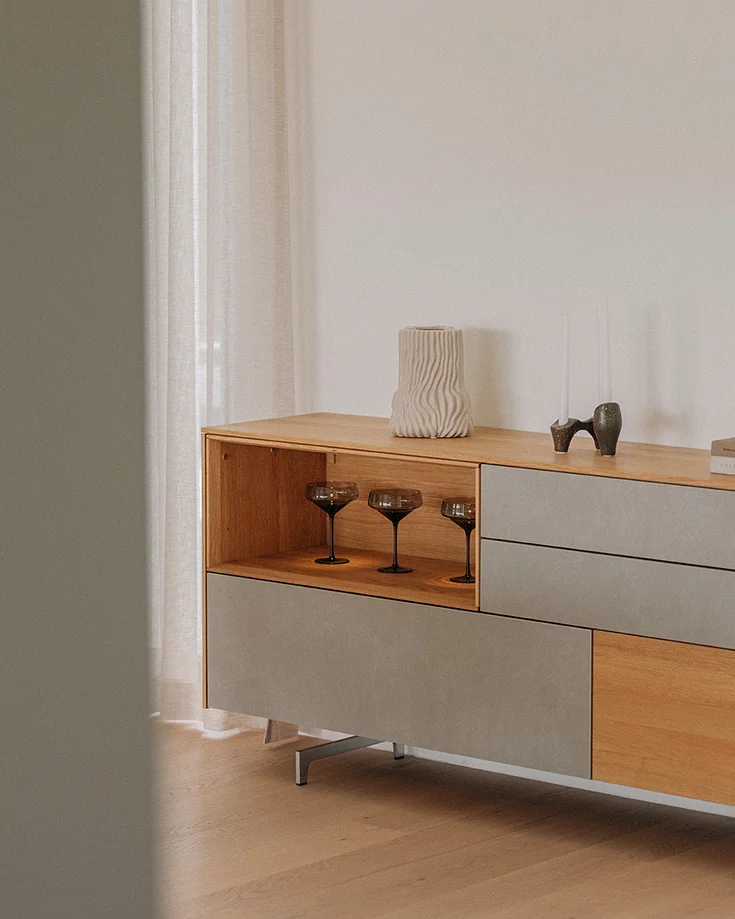 Elegant sideboard in natural oak oil with ceramic fronts on matt metal runners