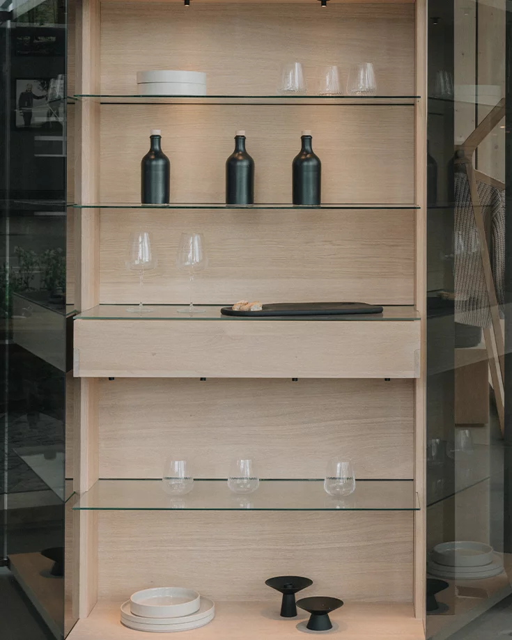 modern nox highboard made of solid in oak white oil, decorated with various crockery items