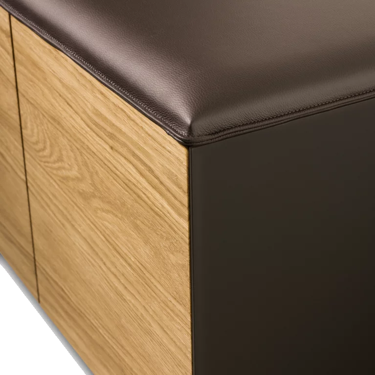 cubus pure sideboard with upholstered seating in leather and graphite grey coloured glass on the sides