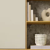 Elegant solid wood shelving filigno in natural oiled oak with doors in greige coloured glass and MDi iseo gries back panels