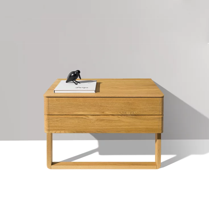 float bedside cabinet in oak with wood sliders and a large drawer