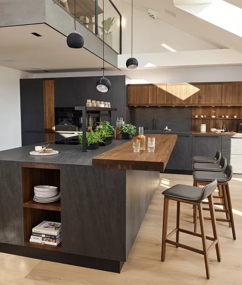 solid wood kitchen with ceramic, bar top and bar stools echt.zeit solid wood kitchen in walnut with basalt black ceramic and bar top with bar stools