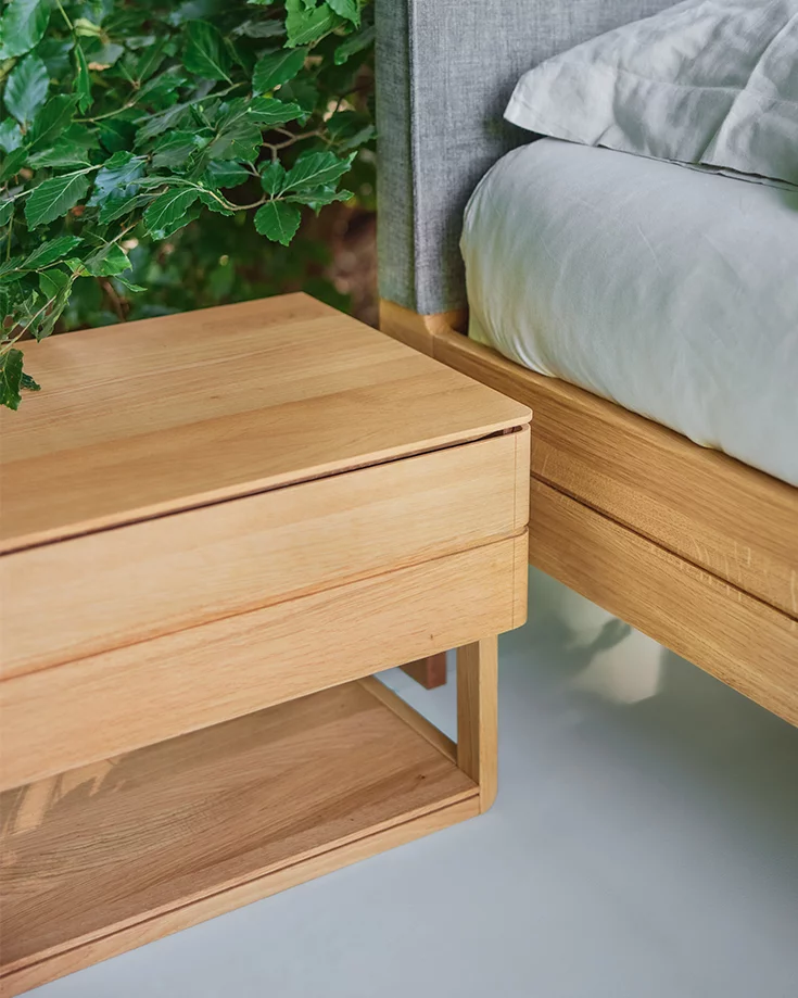 float free standing bedside cabinet in oak with large drawer