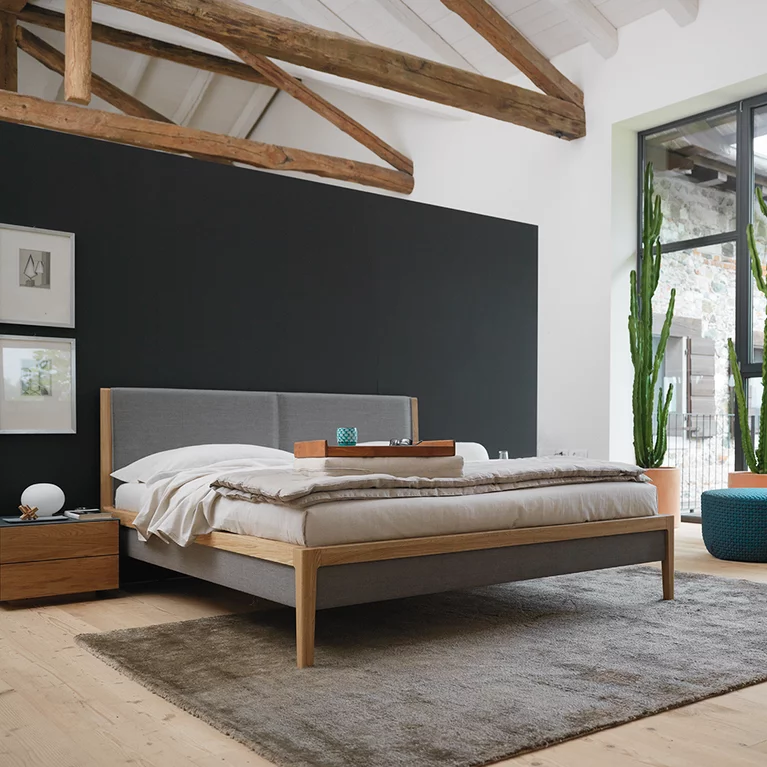 mylon bed in oak with headboard and bed sides in fabric