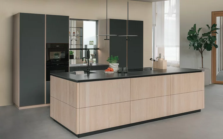 handleless pur solid wood kitchen in oak white oil with graphite grey matt coloured glass and infinity brown natural stone