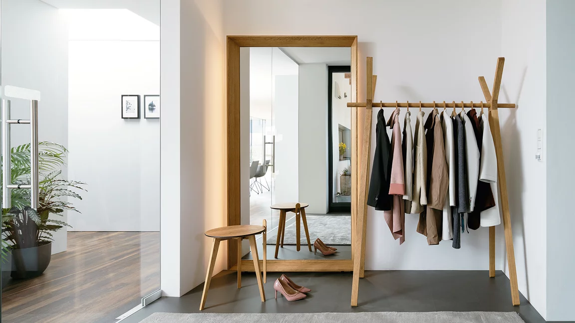 haiku mirror panel next to hood coat rack and hi! side table in solid oak