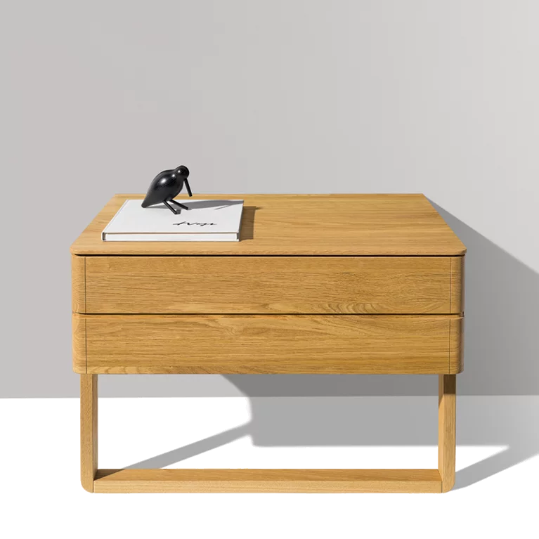 float bedside cabinet in oak with wood sliders and a large drawer