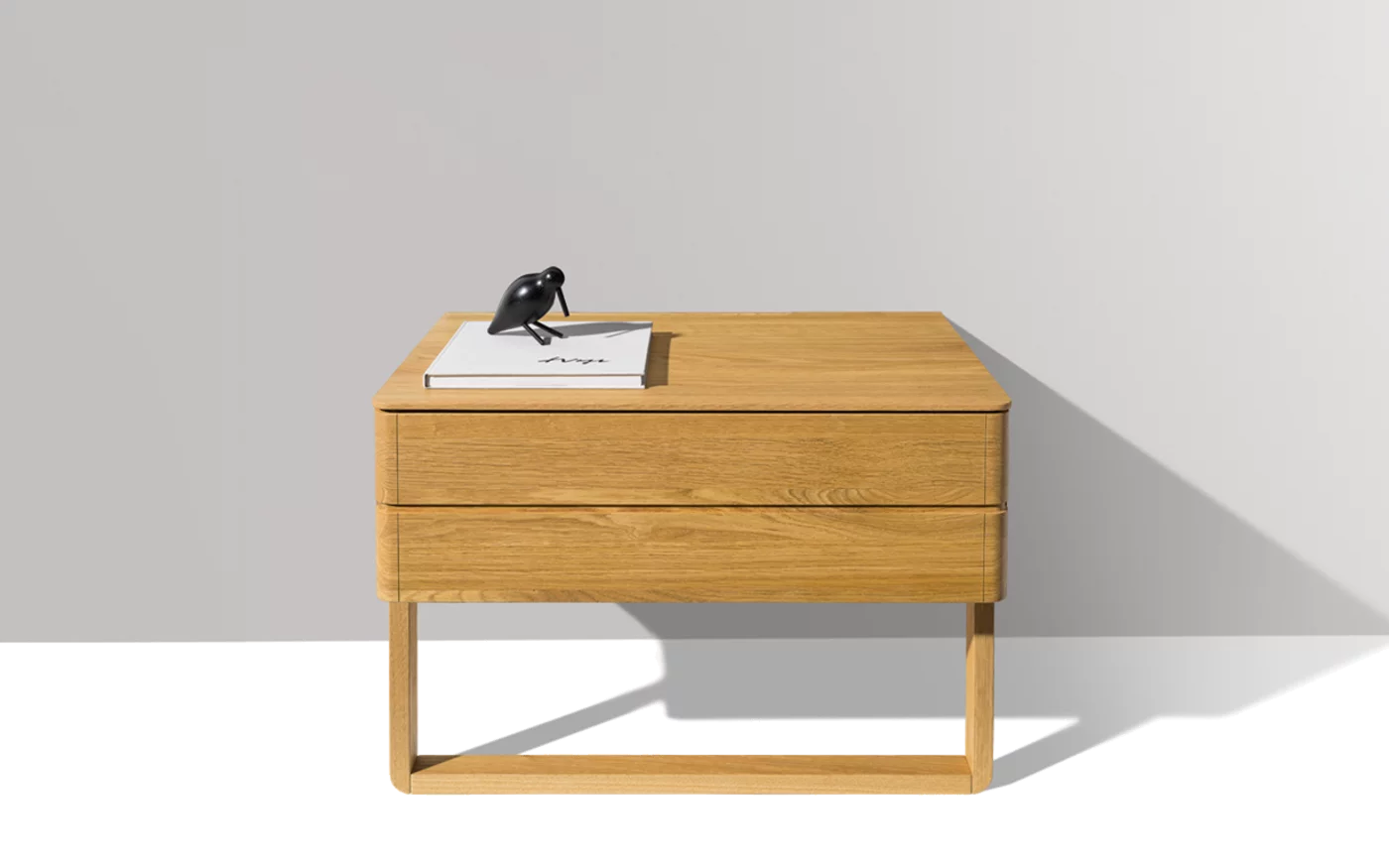 float bedside cabinet in oak with wood sliders and a large drawer