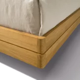 float bedside cabinet in oak with rounded corners