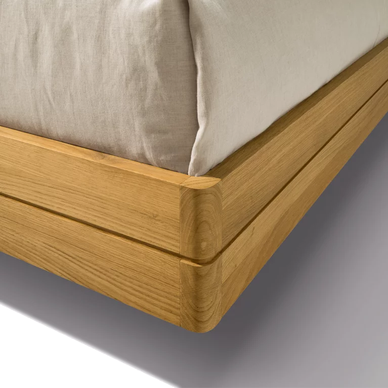 float bedside cabinet in oak with rounded corners
