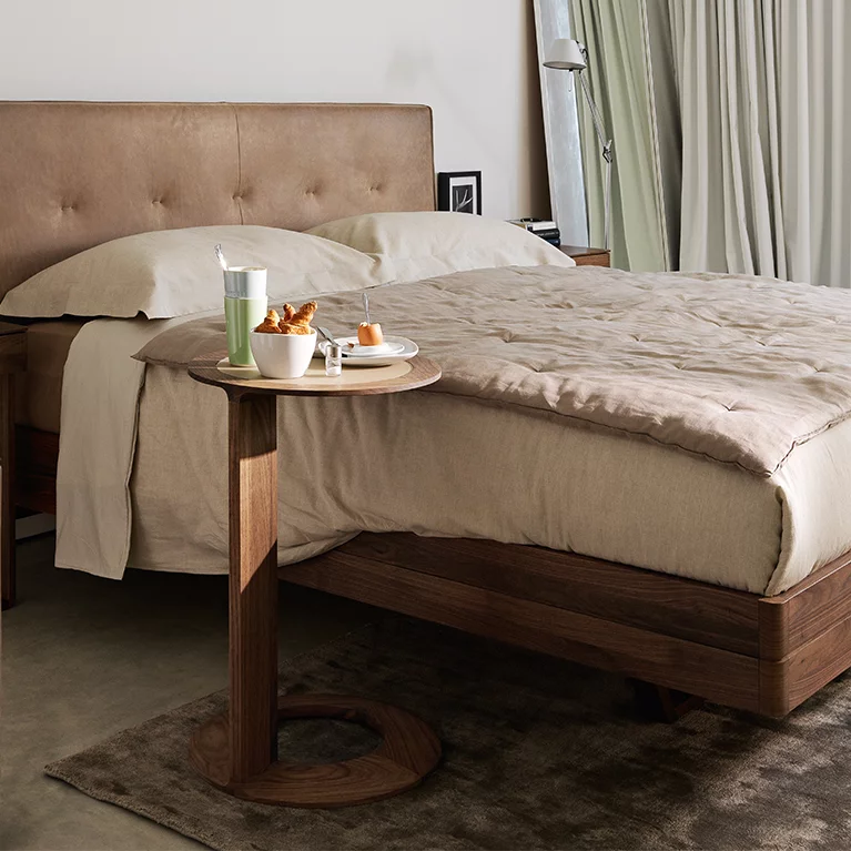 loup side table coloured glass pebble matt with the float bed and the float bedside cabinet in walnut