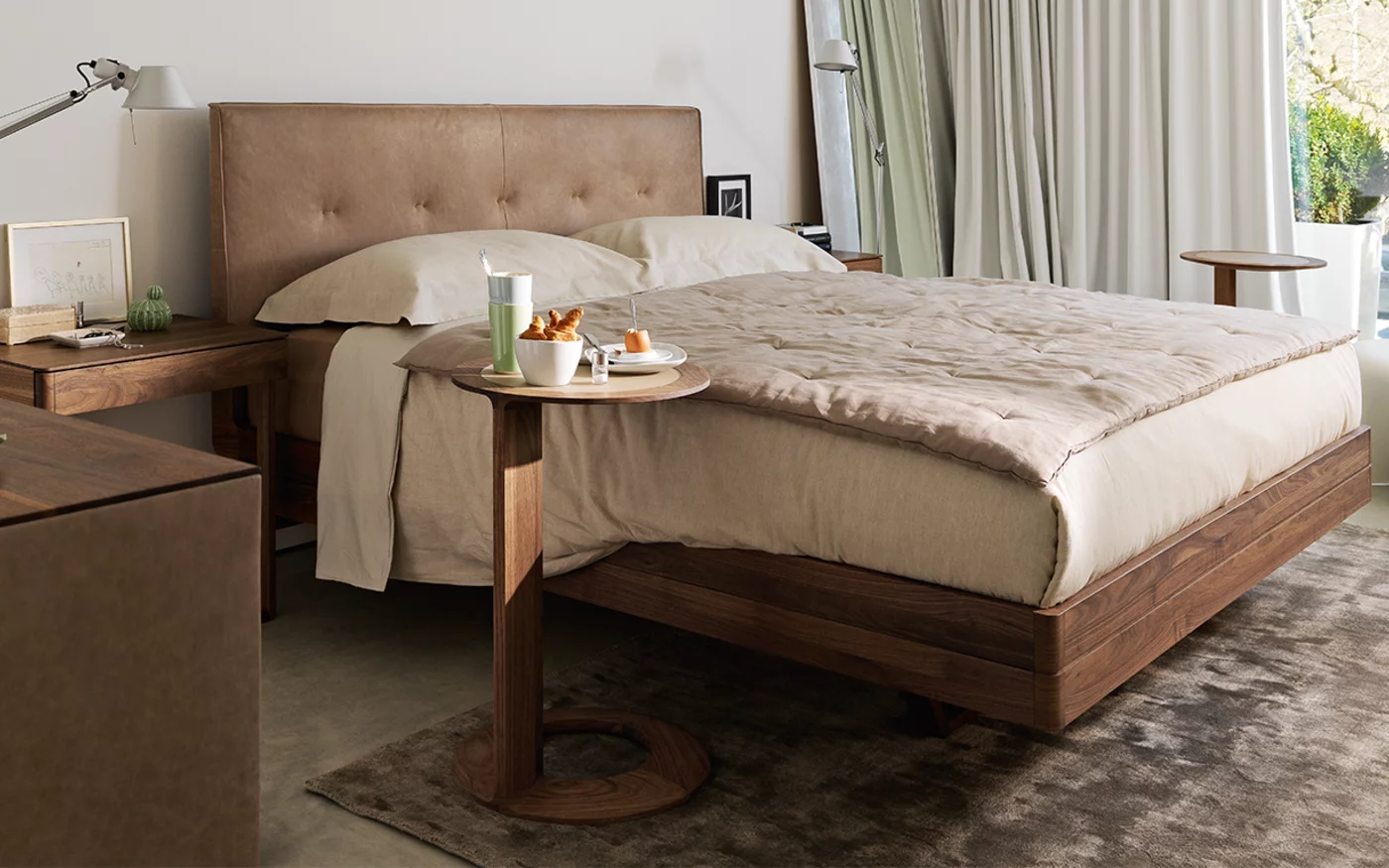 loup side table coloured glass pebble matt with the float bed and the float bedside cabinet in walnut