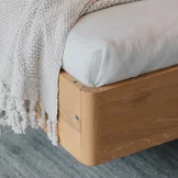 detailed view of the solid wood connection of the footboard of the times bed in wild oak