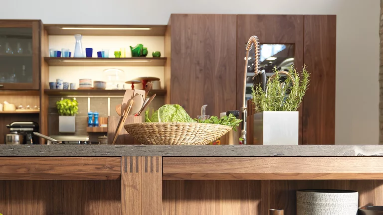 real wood kitchen loft in wild walnut with worktop in brown silk natural stone, detailed view