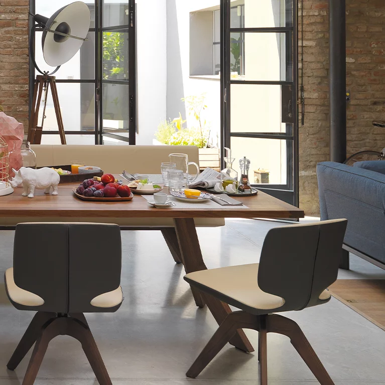 yps extendable dining room table in solid walnut with aye swivel base and the yps upholstered bench with backrest