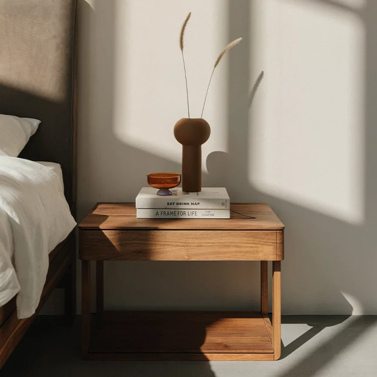 float bedside cabinet in walnut free standing with additional storage surface