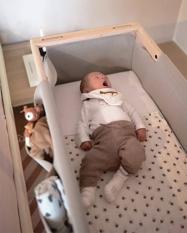 stylish baby cot made of solid wood with knitted fabric stylish baby cot in solid alder white oil with soft knitted fabric and fabric pockets