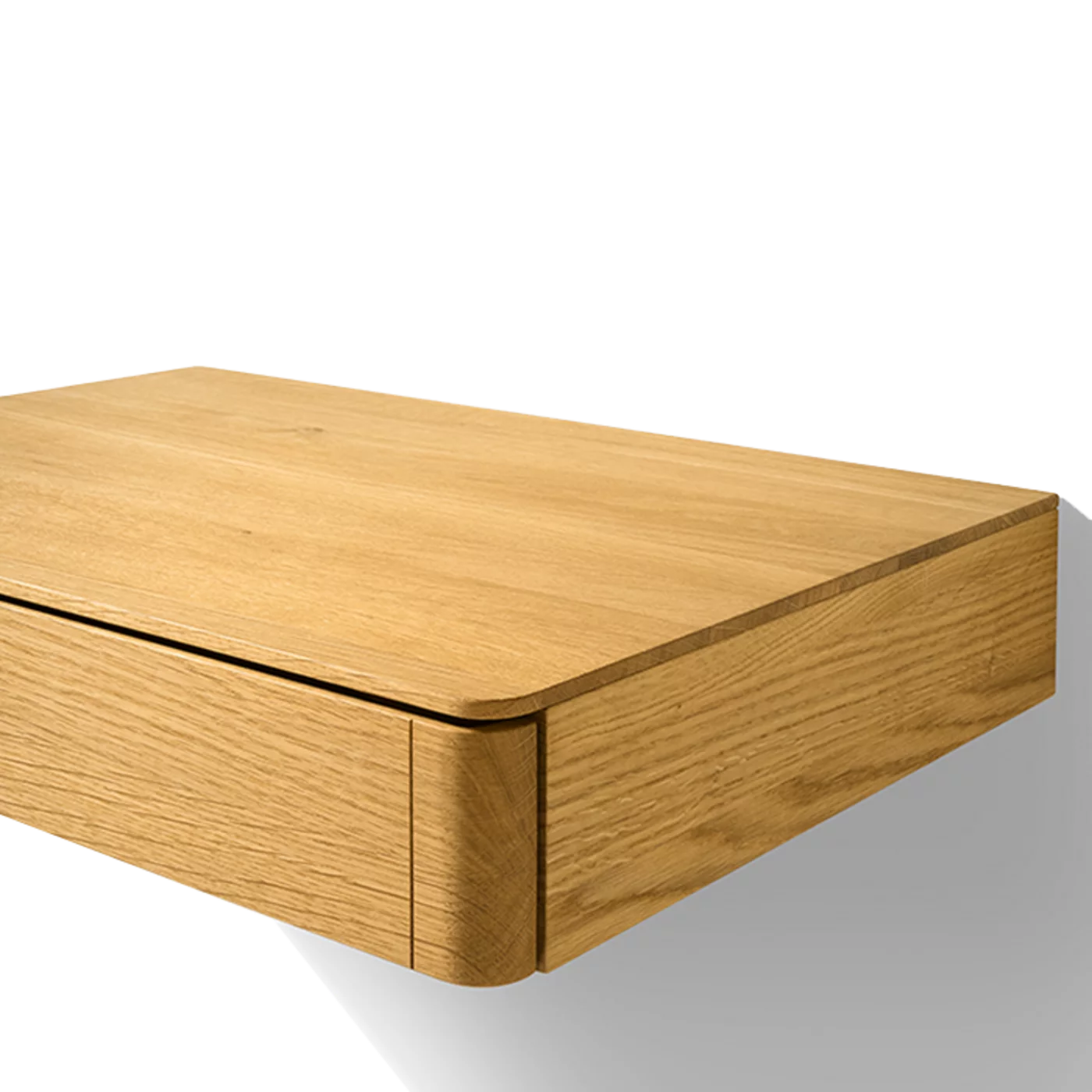 float bedside cabinet in oak with rounded corners