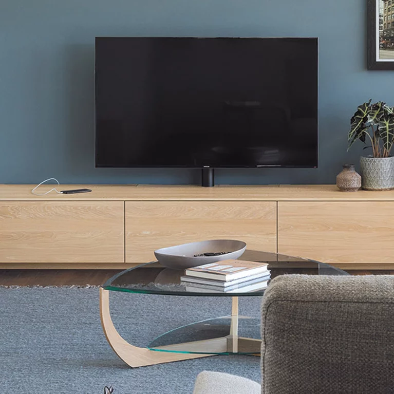 coffee table juwel made of solid oak white oil with transparent glass tops combined with the filigno wall unit