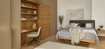 float solid oak bed with leather headboard matching the oak hinged door wardrobe with coloured glass
