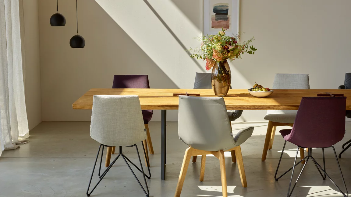 dining table echt.zeit made of wood in rustic brushed oak with the matching lui chair family, side view