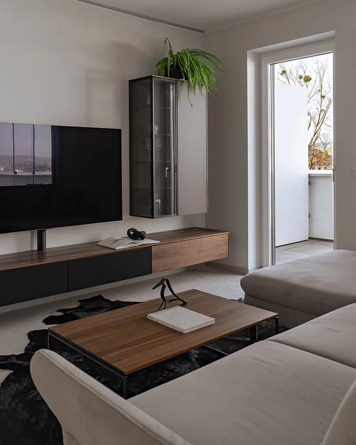 Modern solid walnut wall unit with filigno home entertainment system and filigno coffee table