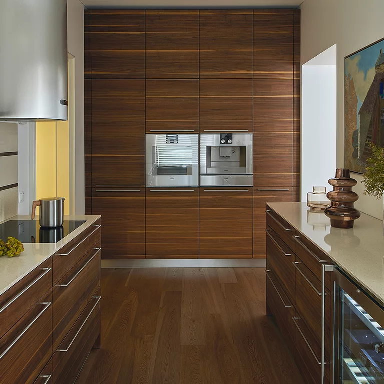 Customised linee solid wood kitchen in walnut, fitted room-high