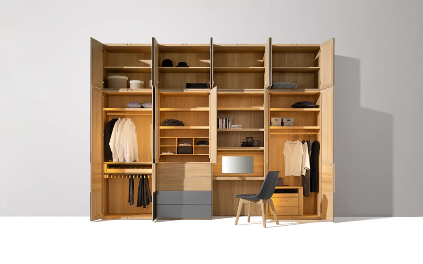 Hinged door wardrobe with solid wood interior to match the lui chair valore hinged door wardrobe illuminated with coloured glass fronts and interior in oak white oil to match the lui chair