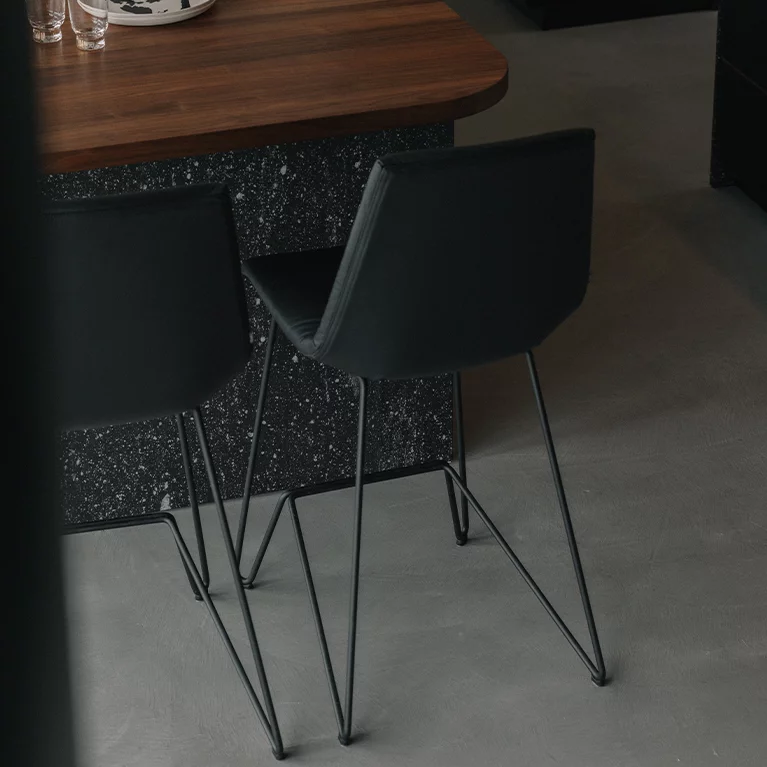 bar stool lui with leather seat shell and frame in matt black, back view