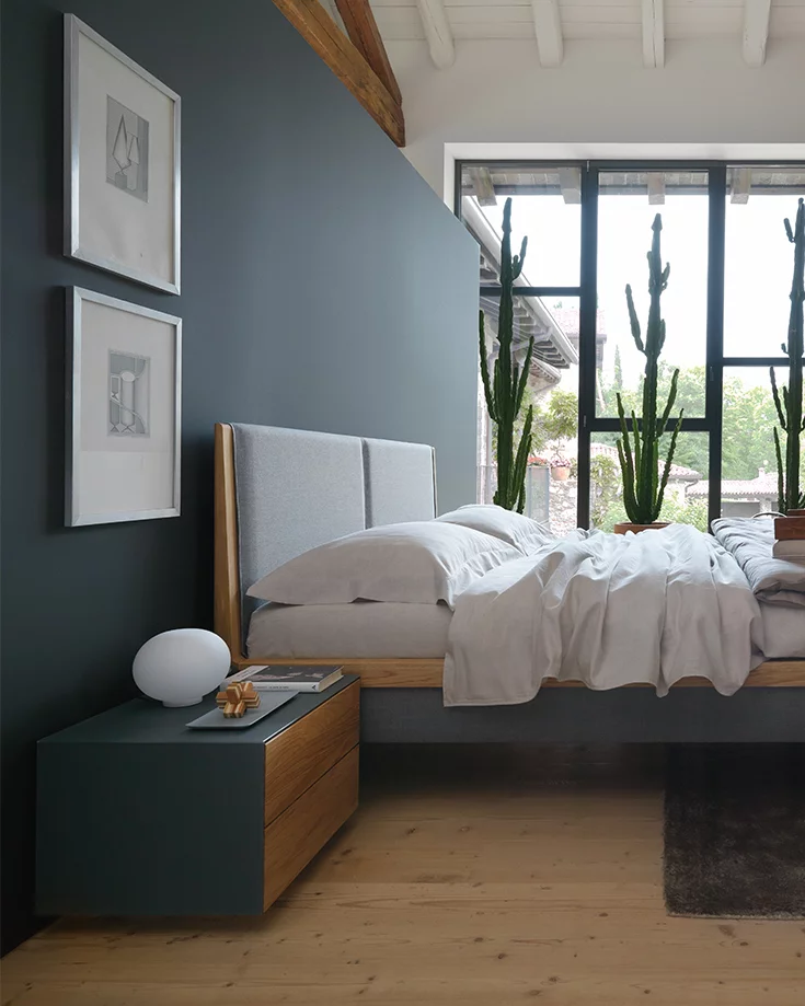 mylon natural wood bed in oak with headboard and bed sides in fabric, side view